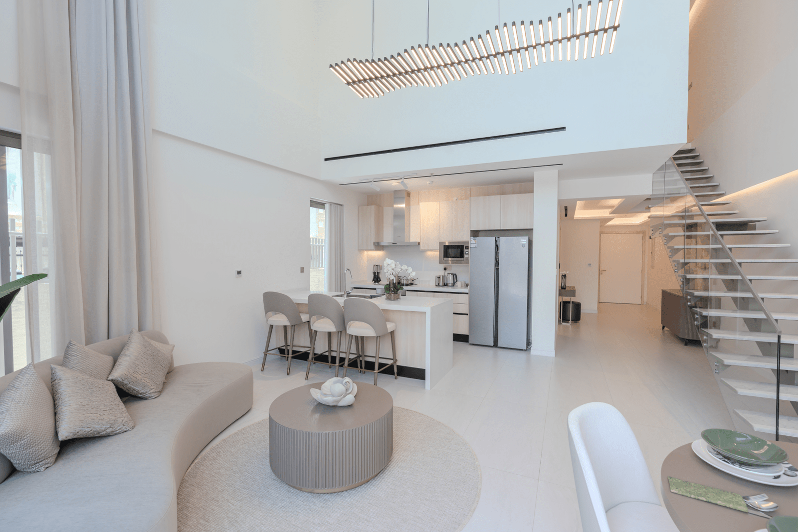 Close-up of the living room seating area with plush sofas and decorative pillows.